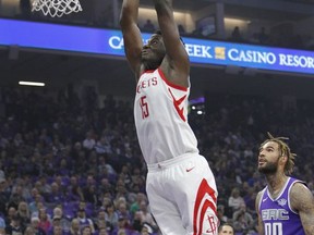 Houston Rockets center Clint Capela (15) drives past Sacramento Kings defender Willie Cauley-Stein (00) for a basket during the first half of an NBA basketball game in Sacramento, Calif., Wednesday, Oct. 18, 2017. (AP Photo/Steve Yeater)