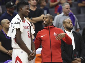 Houston Rockets center Clint Capela (15) and guard Chris Paul talk on the sideline during the second half of an NBA basketball game against the Sacramento Kings in Sacramento, Calif., Wednesday, Oct. 18, 2017. The Rockets won 105-100. (AP Photo/Steve Yeater)