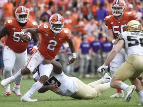 Clemson quarterback Kelly Bryant (2) evades a tackle from Wake Forest defensive lineman Zeek Rodney (93) during the first half of an NCAA college football game, Saturday, Oct. 7, 2017, in Clemson, S.C. (AP Photo/Rainier Ehrhardt)