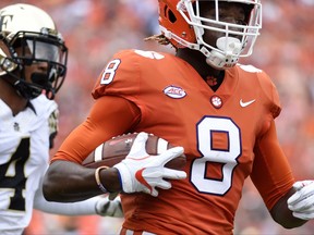 Clemson wide receiver Deon Cain (8) jogs into the end zone for a touchdown as Wake Forest defensive back Amari Henderson (4) defends during the first half of an NCAA college football game, Saturday, Oct. 7, 2017, in Clemson, S.C. (AP Photo/Rainier Ehrhardt)