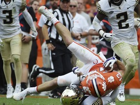 Clemson wide receiver Hunter Renfrow (13) is tackled by Wake Forest defensive back Amari Henderson (4) during the second half of an NCAA college football game, Saturday, Oct. 7, 2017, in Clemson, S.C. (AP Photo/Rainier Ehrhardt)