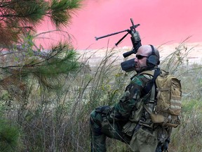 A U.S. Navy SEAL communicates with teammates during exercises at the John C. Stennis Space Center in Mississippi in 2010.
