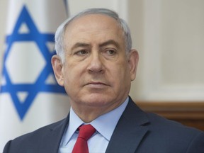 Israeli Prime Minister Benjamin Netanyahu attends the weekly cabinet meeting at his office in Jerusalem, Sunday, Oct. 1, 2017. (AP Photo/Sebastian Scheiner)
