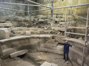 Israel's Antiquities Authority's  Joe Uziel stands in an ancient Roman theater-like structure in the Western Wall tunnels in Jerusalem's old city, Monday, Oct. 16, 2017. Israeli archaeologists have announced the discovery of the first known Roman-era theater in Jerusalem's Old City, a unique 1,800-year-old structure abutting the Western Wall that is believed to have been built during Roman Emperor Hadrian's reign. (AP Photo/Sebastian Scheiner)