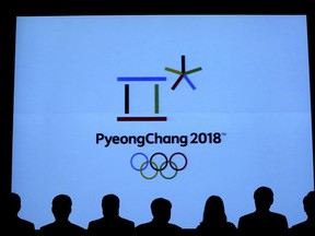 In this Sept. 1, 2017, photo, Lee Hee-beom, center, president of the Pyeongchang Organizing Committee for the 2018 Olympic and Paralympic Winter Games, and attendance are silhouetted as they participate in a launching ceremony of the commemorative coins and bank notes for the 2018 Winter Olympic Games in Seoul, South Korea. The Winter Olympics coming to South Korea in February offer an example of the Olympian efforts often required to meet corporate sponsorship goals. Tokyo tells a different story: The coffers are already overflowing for the 2020 Summer Games. It's a tale of two cities and two Olympics - winter and summer. (AP Photo/Ahn Young-joon)