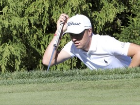 Justin Thomas of the United States lines up his putt on the second hole during the third round of the CJ Cup golf tournament at Nine Bridges on Jeju Island, South Korea, Saturday, Oct. 21, 2017. (Ko Bum Joon/Newsis via AP)