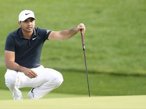 Jason Day of Australia lines up his putt during the first round of the CJ Cup at Nine Bridges, as the first official PGA Tour in South Korea, on Jeju Island, South Korea, Thursday, Oct. 19, 2017. (Park Ji-ho/Yonhap via AP)