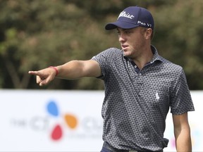 Justin Thomas of United States points on the third hole during the first round of the CJ Cup at Nine Bridges, as the first official PGA Tour in South Korea, on Jeju Island, South Korea, Thursday, Oct. 19, 2017. (Park Ji-ho/Yonhap via AP)