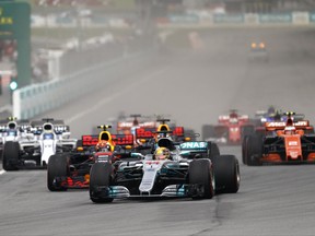 Mercedes driver Lewis Hamilton of Britain leads the field into turn one at the start of the Malaysian Formula One Grand Prix in Sepang, Malaysia, Sunday, Oct. 1, 2017. (AP Photo/Eric To)