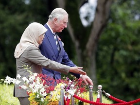 Britain's Prince Charles, right, attends a welcome ceremony with Singapore's President Halimah Yacob at the Istana or Presidential Palace in Singapore, Tuesday, Oct. 31, 2017. (AP Photo/Yong Teck Lim)