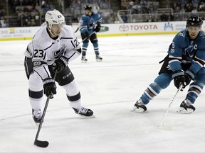 Los Angeles Kings' Dustin Brown (23) prepares to shoot and score past San Jose Sharks' Joe Pavelski (8) during the first period of an NHL hockey game Saturday, Oct. 7, 2017, in San Jose , Calif. (AP Photo/Marcio Jose Sanchez)