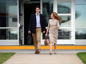 Prime Minister Justin Trudeau and Sophie Gregoire Trudeau depart Ottawa on Tuesday, Oct. 10, 2017, en route to Washington, D.C. THE CANADIAN PRESS/Sean Kilpatrick