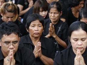 Thai mourners praying for the late King Bhumibol Adulyadej take part in the Royal Cremation ceremony in Bangkok, Thailand, Wednesday, Oct. 25, 2017. Thailand on Wednesday began an elaborate five-day funeral for King Bhumibol with his son, the new monarch, performing Buddhist merit-making rites in preparation for moving Bhumibol's remains to a spectacular golden crematorium. (AP Photo/Sakchai Lalit)