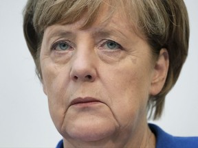 German Chancellor and chairwoman of the German Christian Democratic Party (CDU), Angela Merkel, attends a press conference at the party's headquarter in Berlin, Germany, Monday, Oct. 16, 2017 one day after the elections in the German state of Lower Saxony. (AP Photo/Michael Sohn)