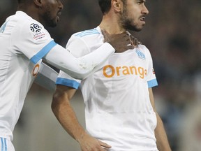 Marseille's Luis Sanson, right, celebrates after scoring during their French League one soccer match against Lille at the Lille Metropole stadium, in Villeneuve d'Ascq, northern France, Sunday, Oct. 29, 2017. (AP Photo/Michel Spingler)