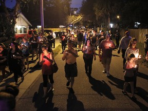 A peaceful march that began on east New Orleans Avenue was held during a candlelight vigil for the three victims who were killed in the recent shootings in the Seminole Heights neighbourhood in Tampa on Sunday, Oct. 22, 2017.