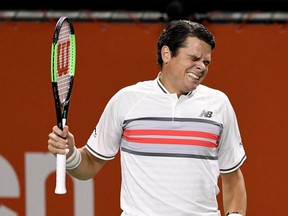 Milos Raonic grimaces during his Japan Open match against Yuichi Sugita on Oct. 5.