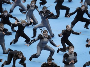 Dancers perform before a handover ceremony for the Olympic Flame at Panathenaic stadium in Athens, Tuesday, Oct. 31, 2017. The South Korean leg of the relay will involve 7,500 torch-bearers, who will cover a total 2,018 kilometers (about 1260 miles) before the opening ceremony in Pyeongchang, which will host the Feb. 9-25, 2018 Winter Olympics. (AP Photo/Thanassis Stavrakis)