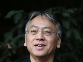 British novelist Kazuo Ishiguro smiles during a press conference at his home in London, Thursday Oct. 5, 2017. Ishiguro, best known for "The Remains of the Day," won the Nobel Literature Prize on Thursday, marking a return to traditional literature following two years of unconventional choices by the Swedish Academy for the 9-million-kronor ($1.1 million) prize. (AP Photo/Alastair Grant)