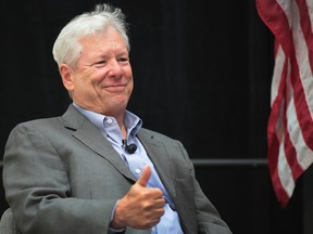 University of Chicago Professor Richard Thaler speaks to guests during a reception at the university after learning he had been award the Nobel Prize for economics.