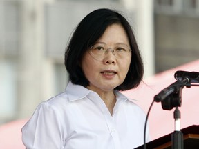 FILE - In this June 10, 2017 file photo, Taiwan's President Tsai Ing-wen delivers a speech during an offshore anti-terrorism drill outside the Keelung harbor in New Taipei City, Taiwan. Tsai said her island's government will protect regional peace and stability amid heightened tensions with rival China, in an annual National Day address Tuesday, Oct. 10, 2017. (AP Photo/Chiang Ying-ying, File)