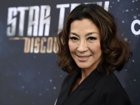 FILE - In this Sept. 19, 2017 file photo, Michelle Yeoh, a cast member in "Star Trek: Discovery," poses at the premiere of the new television series, in Los Angeles. The Malaysian film star commented Tuesday, Oct. 17, 2017 in a statement to The Associated Press on the sexual harassment scandal surrounding Harvey Weinstein. (Photo by Chris Pizzello/Invision/AP, File)