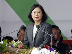 FILE - In this Oct. 10, 2017 file photo, Taiwan's President Tsai Ing-wen delivers a speech during the National Day celebrations in front of the Presidential Building in Taipei. Taiwan's President Tsai  is setting off for the United States and three South Pacific nations in an effort to crack the diplomatic isolation imposed by rival China. Tsai will visit the Marshall and Solomon Islands along with Tuvalu starting from Saturday, Oct. 28. (AP Photo/Chiang Ying-ying, File)