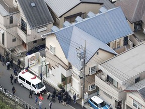 This aerial photo shows the apartment, centre, where police found dismembered bodies in coolers in Zama city, southwest of Tokyo on Tuesday, Oct. 31, 2017.