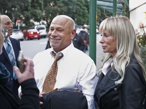 FILE - In this May 2, 2017, file photo, music composer Jeff Bass leaves a courtroom in Wellington, New Zealand. The New Zealand court ordered on Wednesday, Oct. 25, 2017, the nation's main conservative political National Party to pay Eminem's publisher 600,000 New Zealand dollars ($415,000) plus interest for breaching copyright by using a song similar to Eminem's "Lose Yourself" in its campaign ads. The party used the song "Eminem Esque" 186 times during its successful 2014 election campaign before pulling the ad off the air. Publisher Eight Mile Style sued, saying the track was a rip-off of the rapper's acclaimed 2002 hit. (AP Photo/Nick Perry, File)