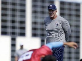 Tennessee Titans head coach Mike Mularkey watches as quarterback Marcus Mariota stretches during NFL football practice Wednesday, Oct. 4, 2017 in Nashville, Tenn. Mariota suffered a strained hamstring Sunday while playing against the Houston Texans. (AP Photo/Mark Humphrey)
