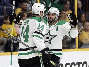 Dallas Stars left wing Jamie Benn (14) is congratulated by Alexander Radulov (47), of Russia, after scoring a goal against the Nashville Predators in the first period of an NHL hockey game Thursday, Oct. 12, 2017, in Nashville, Tenn. (AP Photo/Mark Humphrey)