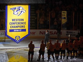 The Western Conference Championship banner is raised by the Nashville Predators before an NHL hockey game between the Predators and the Philadelphia Flyers Tuesday, Oct. 10, 2017, in Nashville, Tenn. (AP Photo/Mike Strasinger)