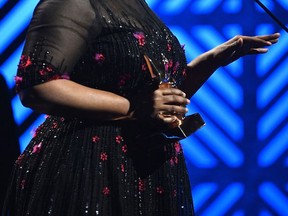 CeCe Winans wins Gospel Artist of the Year at the 2017 Gospel Music Association Dove Awards at Lipscomb University's Allen Arena Tuesday Oct. 17, 2017, in Nashville, Tenn.   (Larry McCormack/The Tennessean via AP)