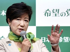 In this Sept. 27, 2017 photo, Tokyo Gov. Yuriko Koike announces the launch of a new political party at a press conference in Tokyo. Just days before Japan's national election campaign kicks off on Oct. 10, 2017, all eyes are on Tokyo's populist governor, a political go-getter and a gambler. Will she jump into the race and try to unseat Prime Minister Shinzo Abe? (Kyodo News via AP)