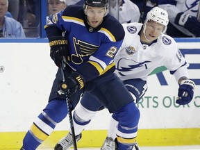 St. Louis Blues center Paul Stastny (26) carries the puck in front of Tampa Bay Lightning left wing Ondrej Palat, of the Czech Republic, during the first period of an NHL hockey game Saturday, Oct. 14, 2017, in Tampa, Fla. (AP Photo/Chris O'Meara)