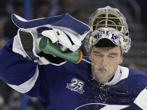 Tampa Bay Lightning goalie Andrei Vasilevskiy, of Russia, sprays water on his face  during a break in the first period of an NHL hockey game against the Pittsburgh Penguins, Thursday, Oct. 12, 2017, in Tampa, Fla. (AP Photo/Chris O'Meara)
