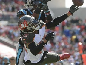 Tampa Bay Buccaneers cornerback Vernon Hargreaves III (28) breaks up a pass intended for Carolina Panthers wide receiver Devin Funchess (17) during the first quarter of an NFL football game Sunday, Oct. 29, 2017, in Tampa, Fla. (AP Photo/Phelan Ebenhack)
