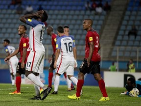 United States striker Jozy Altidore, left, bemoans a missed scoring chance against Trinidad on Oct. 10.