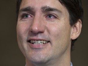 Tears roll down Canadian Prime Minister Justin Trudeau's face as he speaks about Tragically Hip singer Gord Downie before caucus on Parliament Hill, in Ottawa on Wednesday, October 18, 2017.