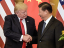 U.S. President Donald Trump shakes hands with China's President Xi Jinping at the end of a press conference in Beijing on Nov. 9, 2017.