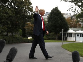 President Donald Trump waves as he walks to board Marine One helicopter on the South Lawn of the White House in Washington, Wednesday, Oct. 11, 2017, for a short trip to Andrews Air Force Base, Md., and then onto Harrisburg, Pa.