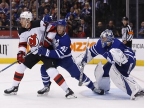 Tyler Bozak of the Maple Leafs tries to move the Devils' Jimmy Hayes in front of Frederik Andersen in Wednesday's loss.