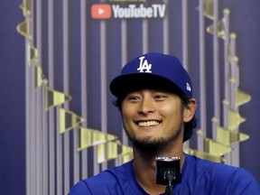 Los Angeles Dodgers starting pitcher Yu Darvish talks to the media during a World Series baseball news conference, Thursday, Oct. 26, 2017, in Houston. Darvish will start for the Dodgers as they play the Houston Astros in Game 3 of the series Friday. (AP Photo/Charlie Riedel)
