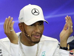 Mercedes driver Lewis Hamilton, of Britain, responds to a question during a news conference for the Formula One U.S. Grand Prix auto race at the Circuit of the Americas, Thursday, Oct. 19, 2017, in Austin, Texas. (AP Photo/Eric Gay)