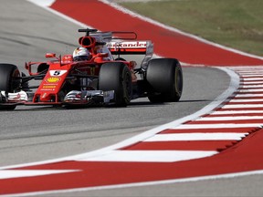 Ferrari driver Sebastian Vettel, of Germany, comes through a turn during the Formula One U.S. Grand Prix auto race at the Circuit of the Americas, Sunday, Oct. 22, 2017, in Austin, Texas. (AP Photo/Darron Cummings)