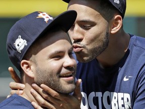 Houston Astros shortstop Carlos Correa, right, jokes with second baseman Jose Altuve during practice Wednesday, Oct. 11, 2017, in Houston. The Astros beat the Red Sox to advance to the ALCS which is set to begin Friday. (AP Photo/David J. Phillip)