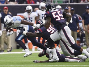 Tennessee Titans running back DeMarco Murray (29) works to break away from Houston Texans nose tackle D.J. Reader (98) during the first half of an NFL football game, Sunday, Oct. 1, 2017, in Houston. (AP Photo/Eric Christian Smith)