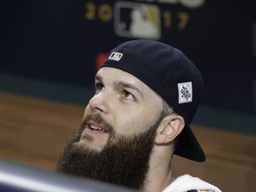Houston Astros starting pitcher Dallas Keuchel stands in the dugout during a practice for a World Series baseball game, Thursday, Oct. 26, 2017, in Houston, Texas. Los Angeles will face the Houston Astros in Game 3 Friday. (AP Photo/Eric Gay)