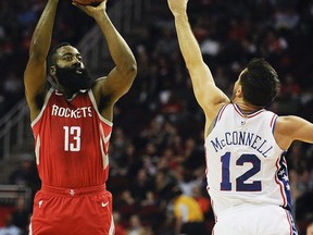 Houston Rockets guard James Harden (13) shoots over Philadelphia 76ers guard T.J. McConnell during the first half of an NBA basketball game, Monday, Oct. 30, 2017, in Houston. (AP Photo/Eric Christian Smith)