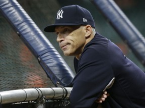 New York Yankees manager Joe Girardi watches batting practice before Game 1 of baseball's American League Championship Series against the Houston Astros Friday, Oct. 13, 2017, in Houston. (AP Photo/Tony Gutierrez)